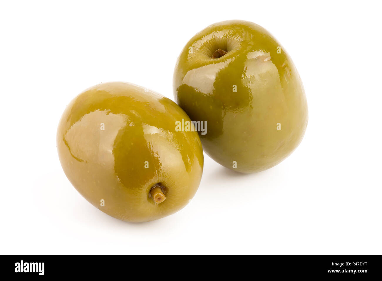 Green olives isolated on a white background Stock Photo - Alamy