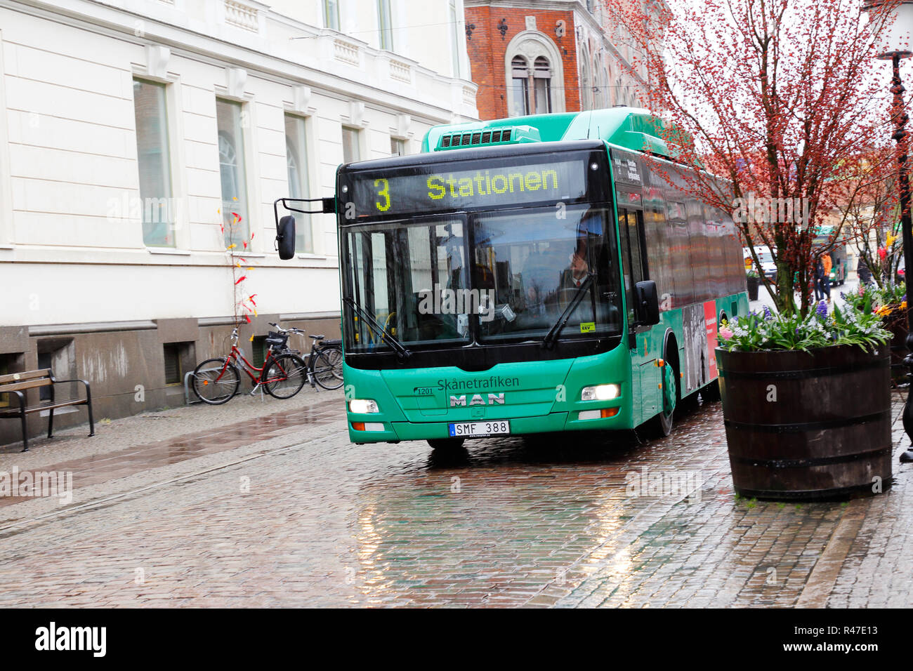 Ystad, Sweden - April 15, 2017: One green city bus operating public transportation line 3 for the Skanetrafiken at the Hamngatan street in the city ce Stock Photo