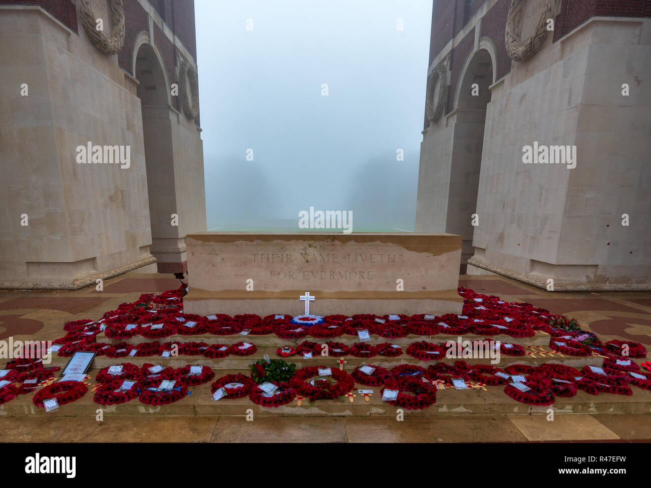 Wreaths laid at Stone gf Remembrance of Thiepval Memorial to the Missing of the Somme in fog Stock Photo