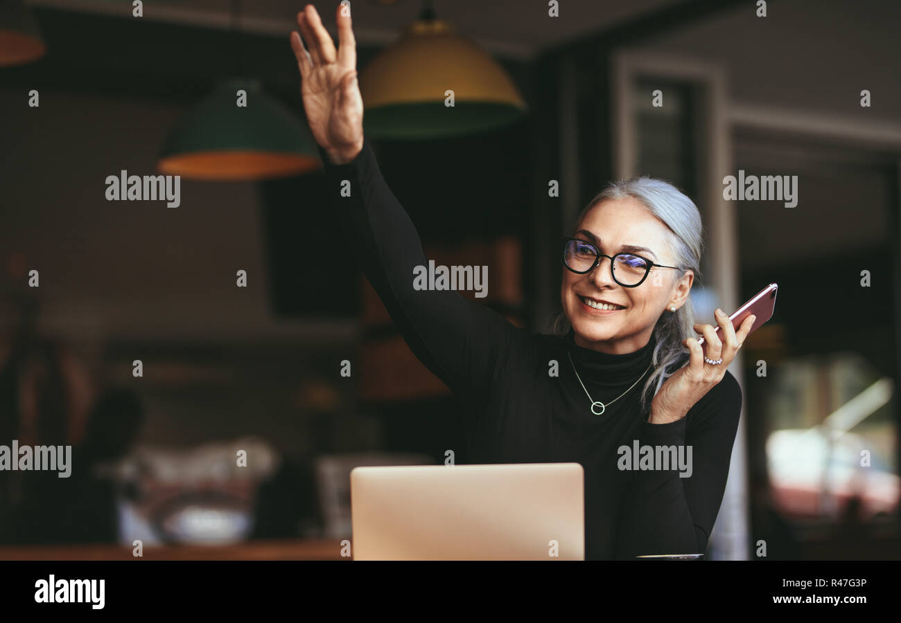 Happy mature woman calling hi-res stock photography and images - Alamy