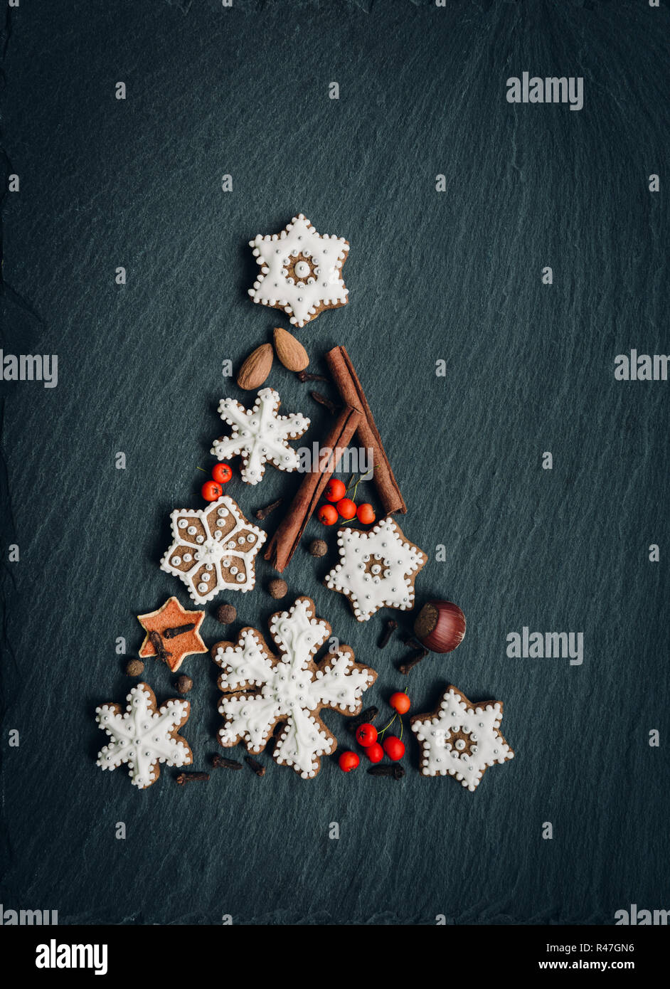 Gingerbread, nuts, spices, dried orange peel create a Christmas tree on