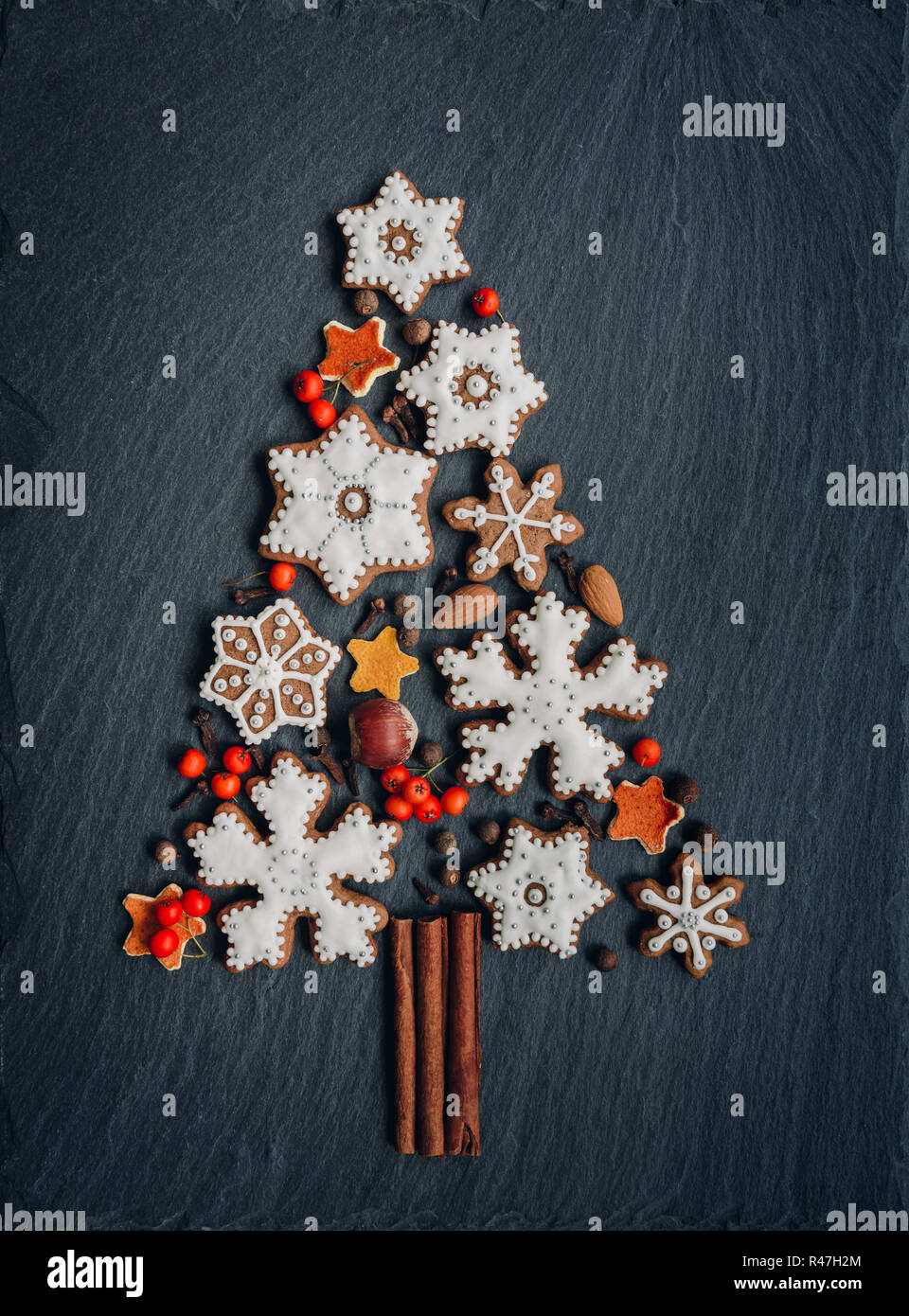 Gingerbread, nuts, spices, dried orange peel create a Christmas tree on