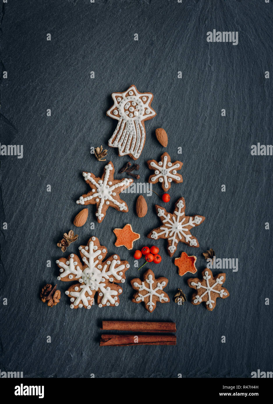 Gingerbread, nuts, spices, dried orange peel create a Christmas tree on