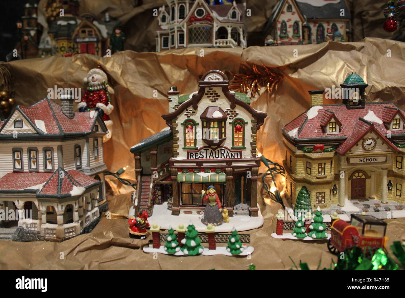 Miniature ceramic restaurant displayed as Christmas holiday ornamental decorations. Stock Photo