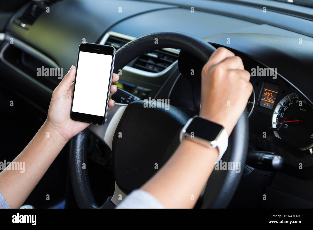 hand holding phone white screen and driving car Stock Photo