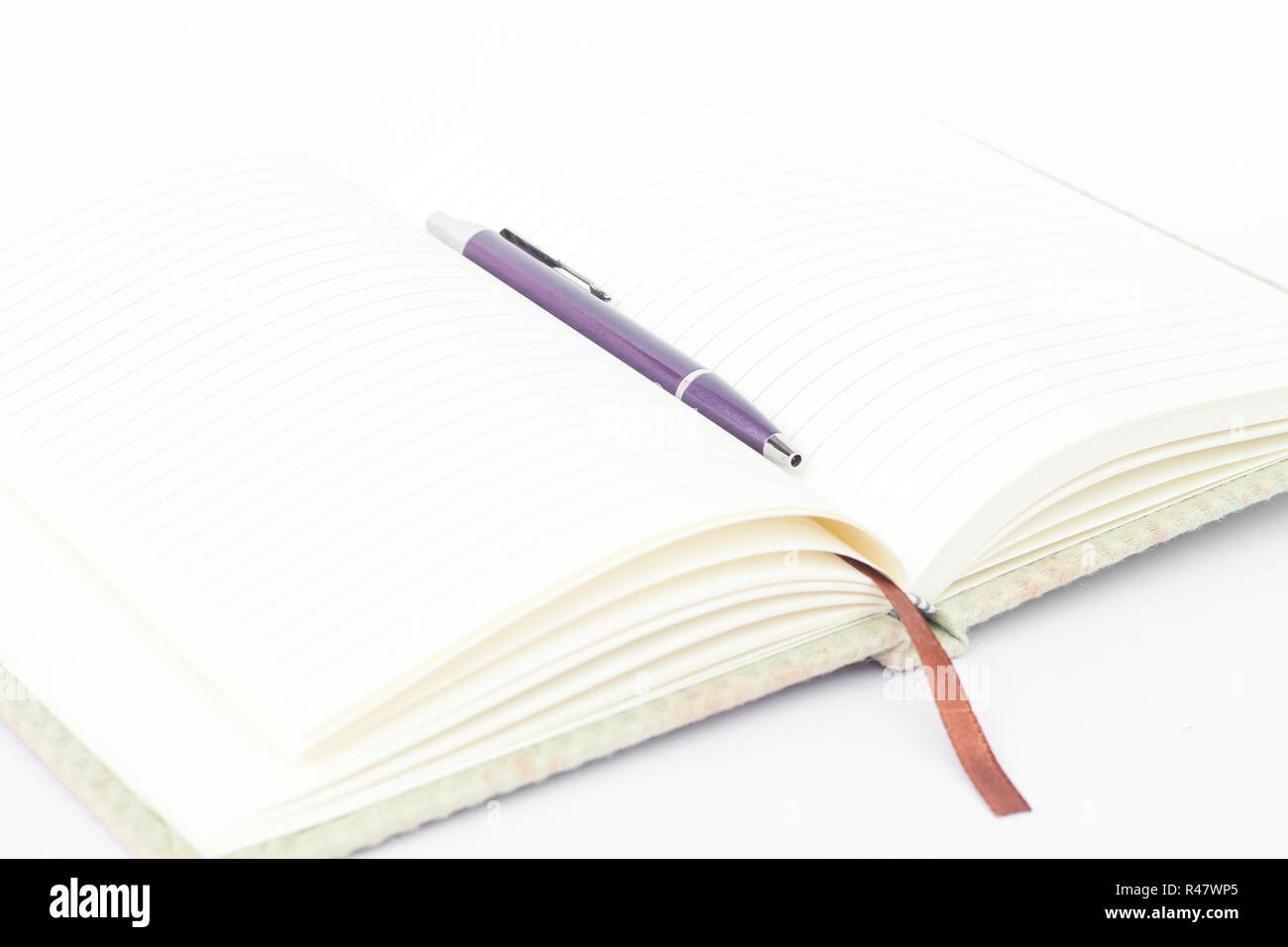 Notebook with pen isolated on white background Stock Photo - Alamy