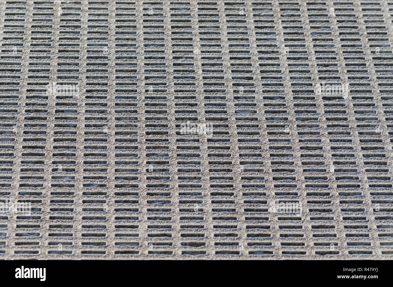gray perforated metal grid background. Stock Photo