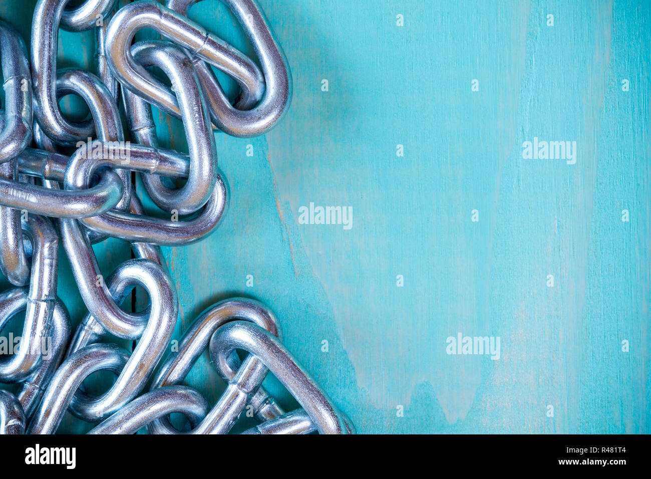 Metal chain on nice wooden background Stock Photo