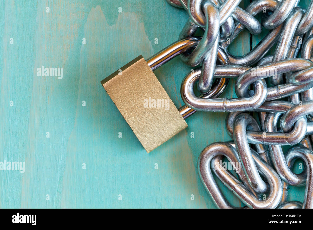 Padlock on the blue wooden background Stock Photo