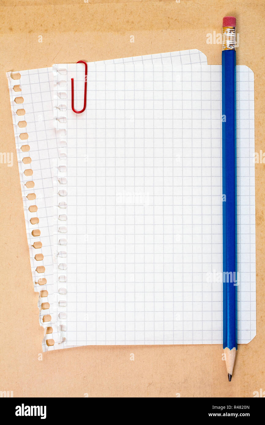 Checked notepad paper and pencil Stock Photo - Alamy