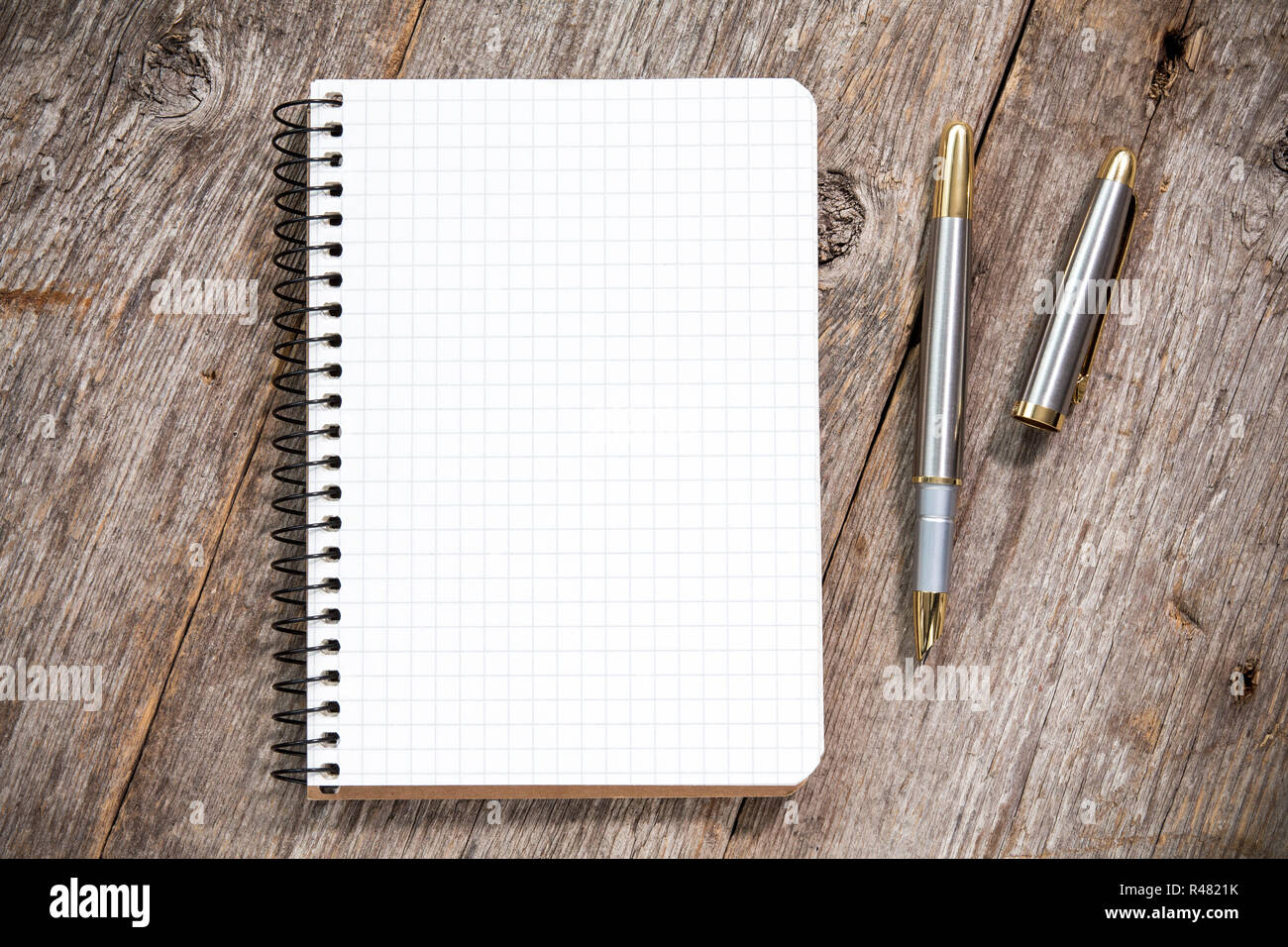 Fountain pen and notebook with square grid Stock Photo