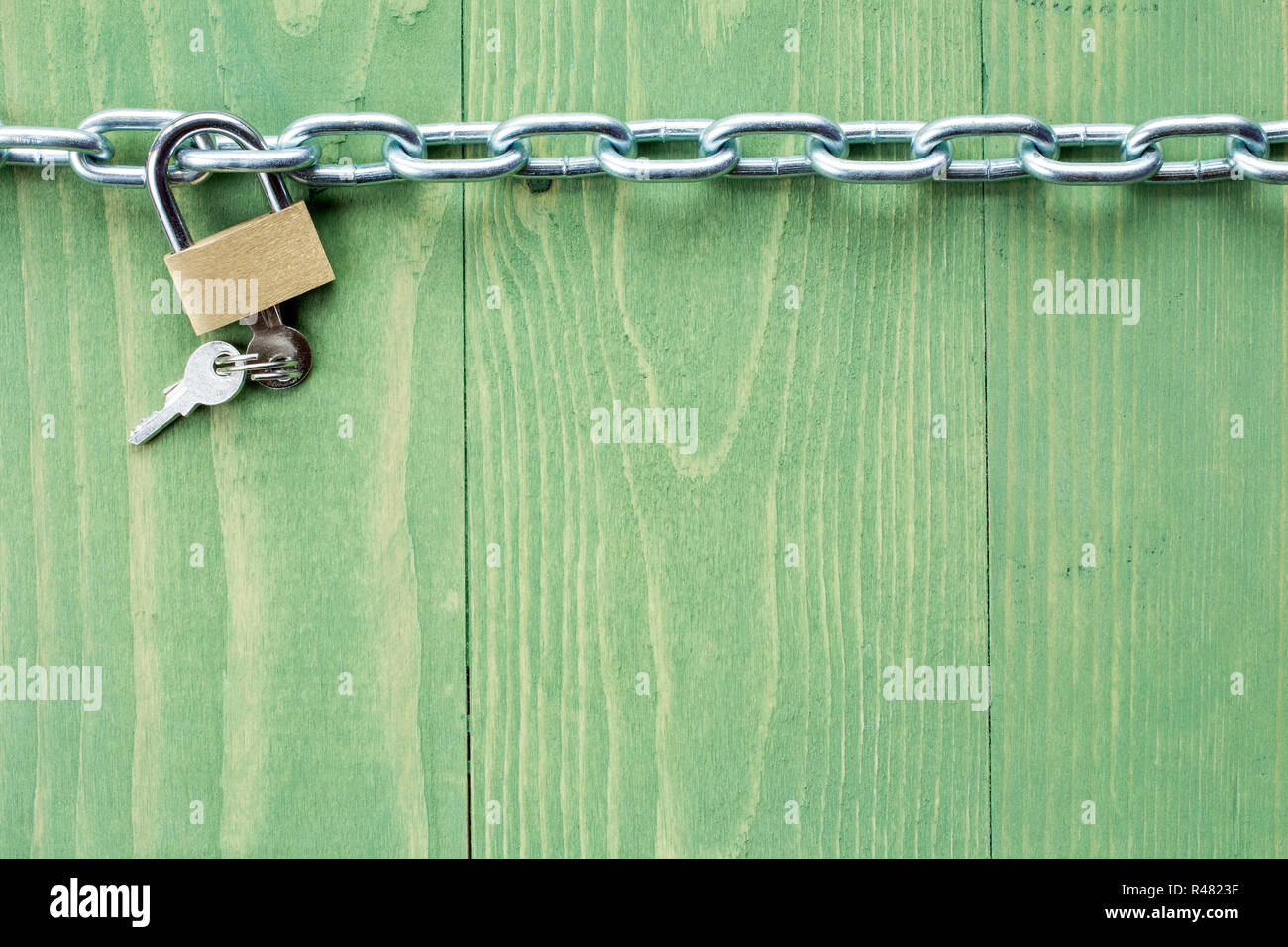 Chain and lock on green  background Stock Photo