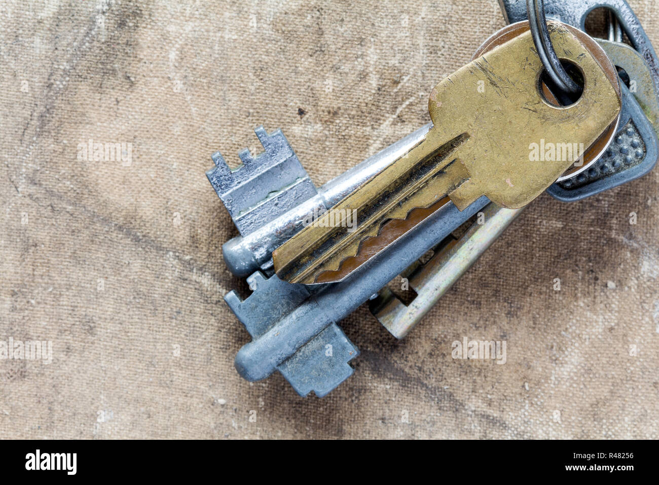 Old keys on dirty canvas Stock Photo