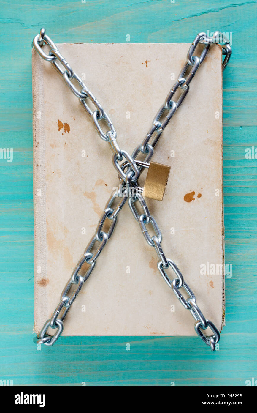 Book protected with a chain and lock Stock Photo