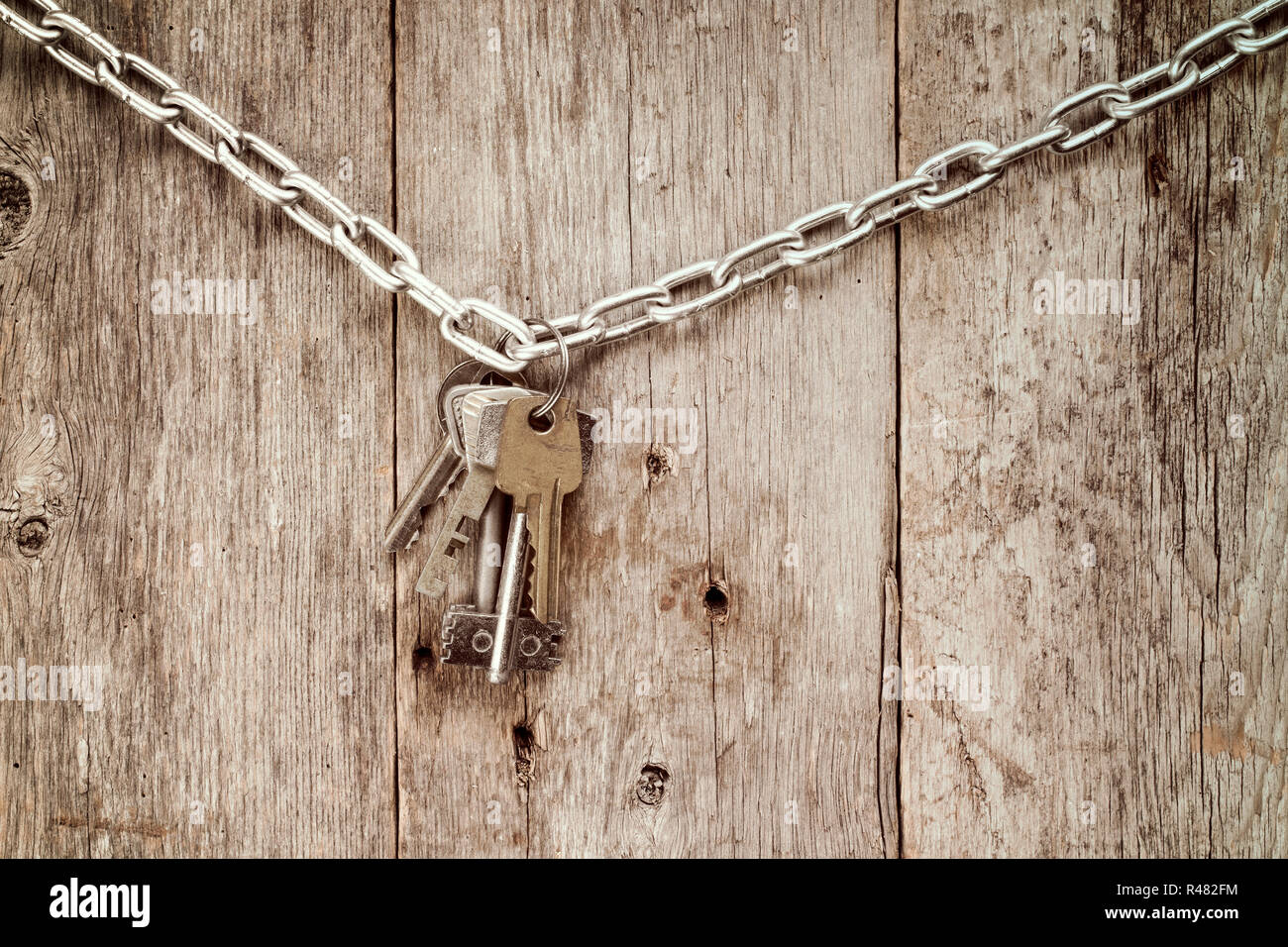 Bunch of keys hanging on chain. Stock Photo