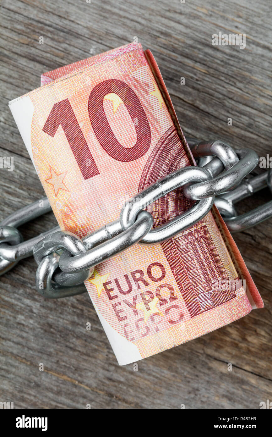 Ten euro bills with chain Stock Photo