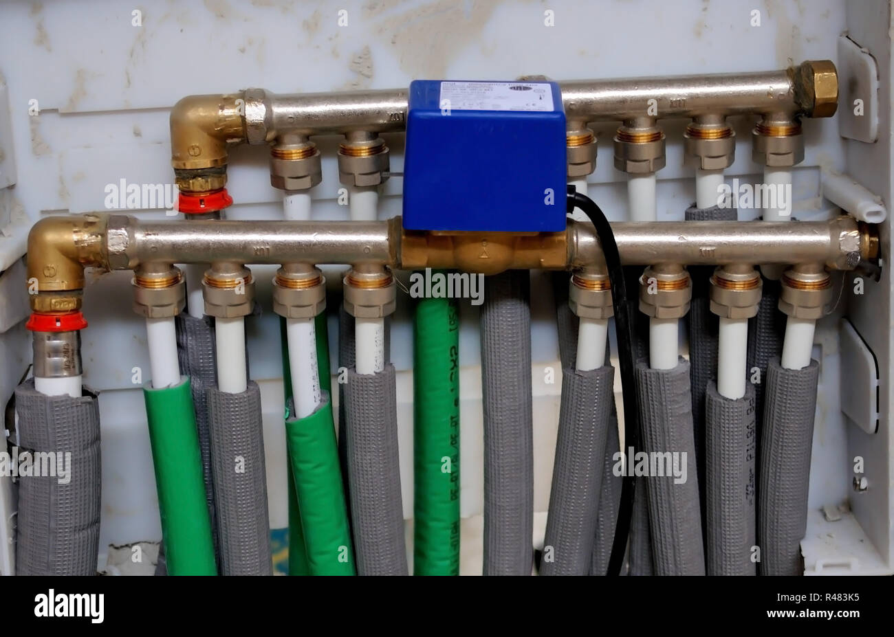 Collector, manifold, heating system for underfloor heating Stock Photo Alamy