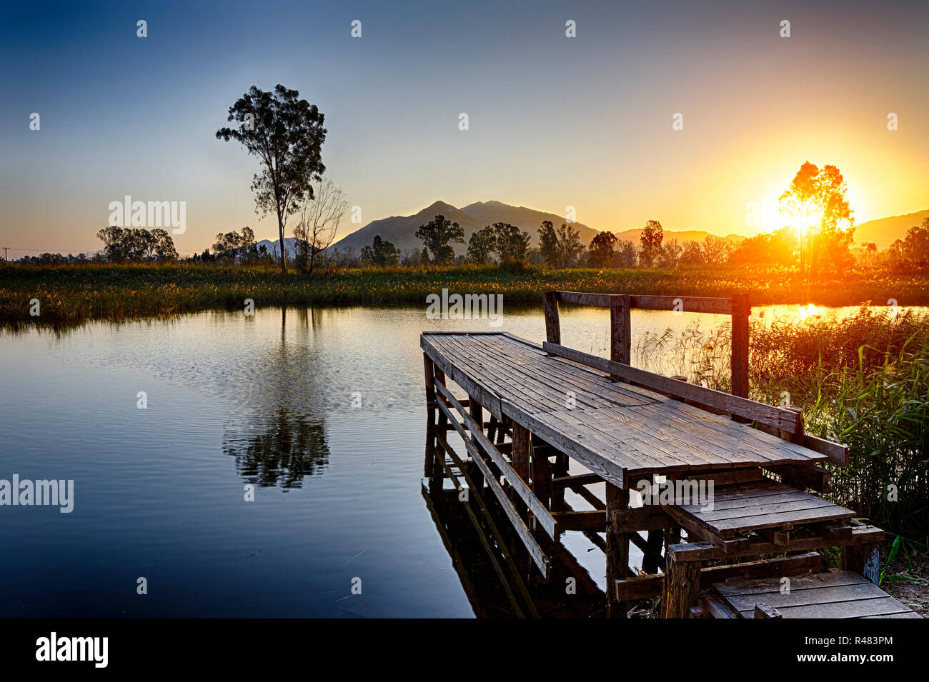 Sunlight over lonely pier hi-res stock photography and images - Alamy