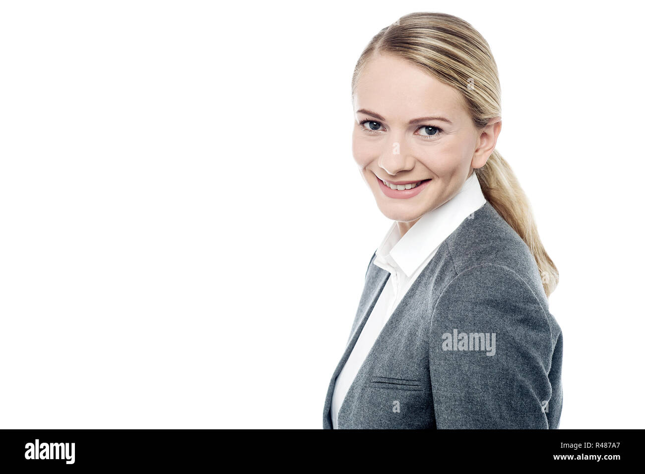 Smiling young business woman Stock Photo - Alamy