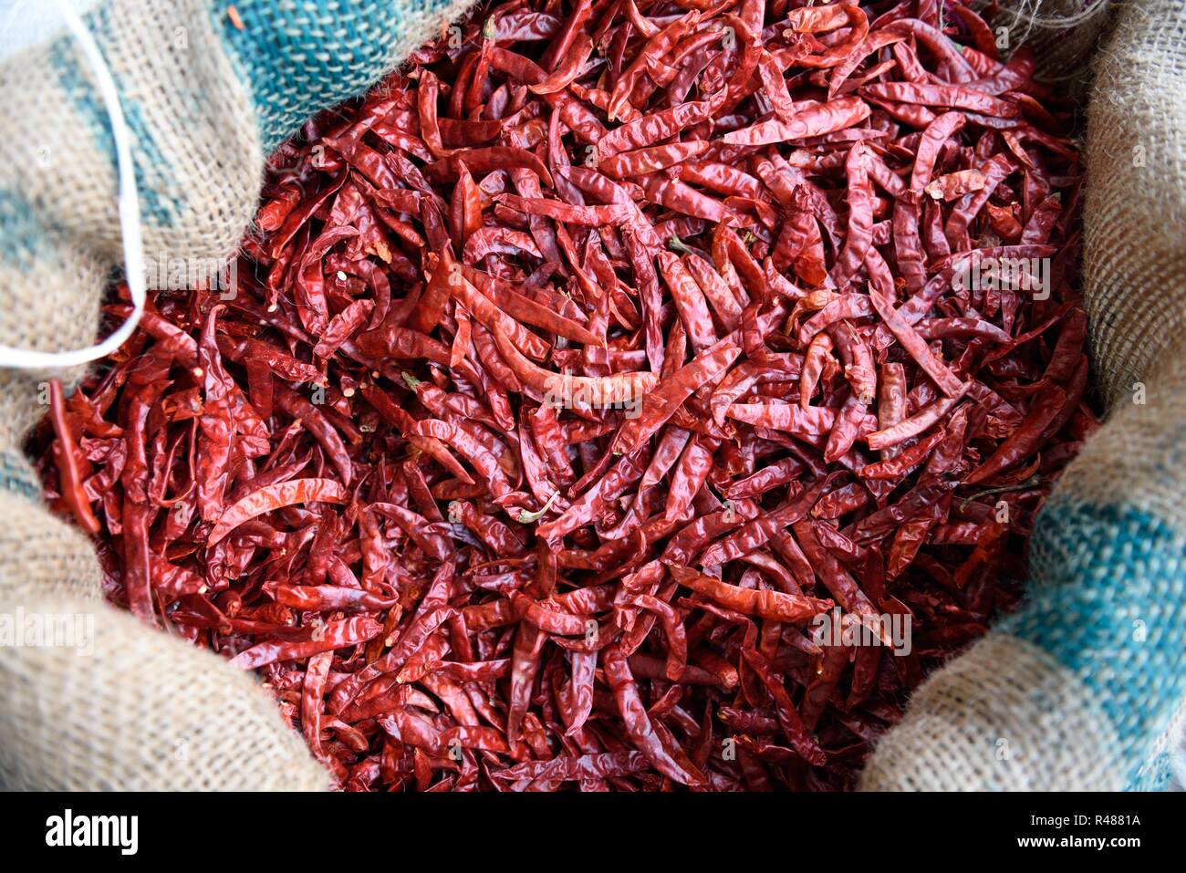 Indian dried red chili peppers, basket of red chili peppers in a spice market of Rajasthan