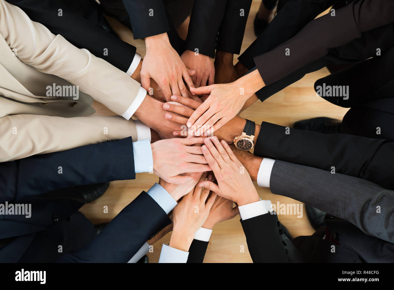 Business Team Stacking Hands On Table Stock Photo Alamy