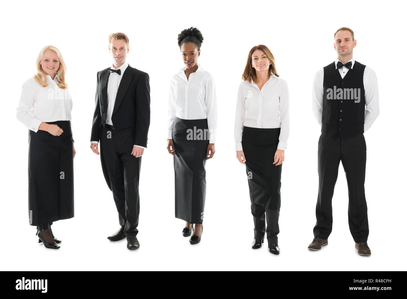 Multi ethnic Restaurant Staff Standing Against White Background Stock Photo