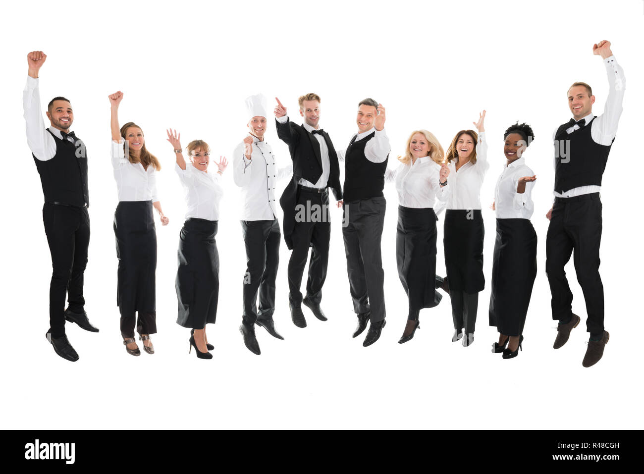 Portrait Of Happy Restaurant Staff Celebrating Success Stock Photo