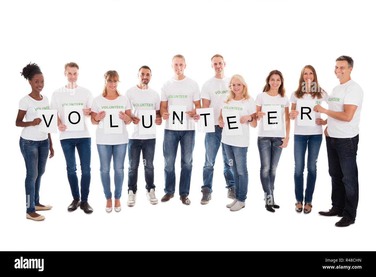 Portrait Of Confident Volunteers Holding Blank Placards Stock Photo