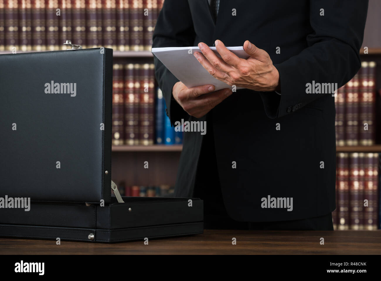 Lawyer Keeping Documents In Briefcase In Office Stock Photo Alamy
