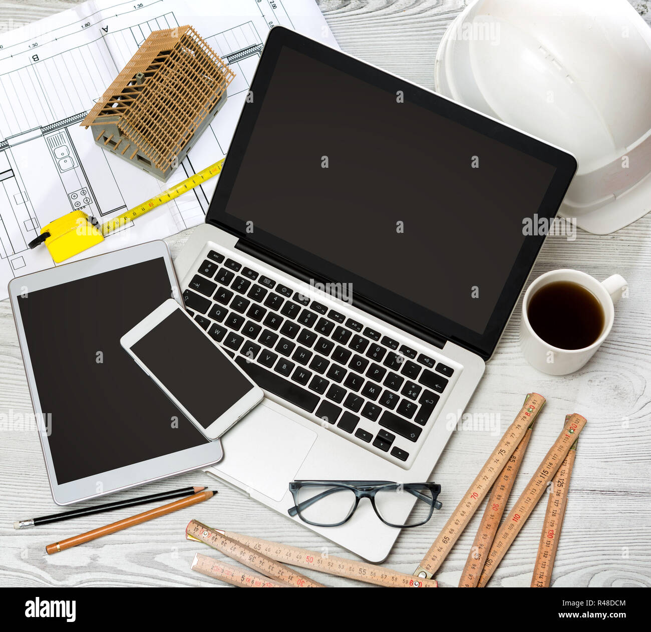 Wood architect's desk in high definition with laptop, tablet and mobile