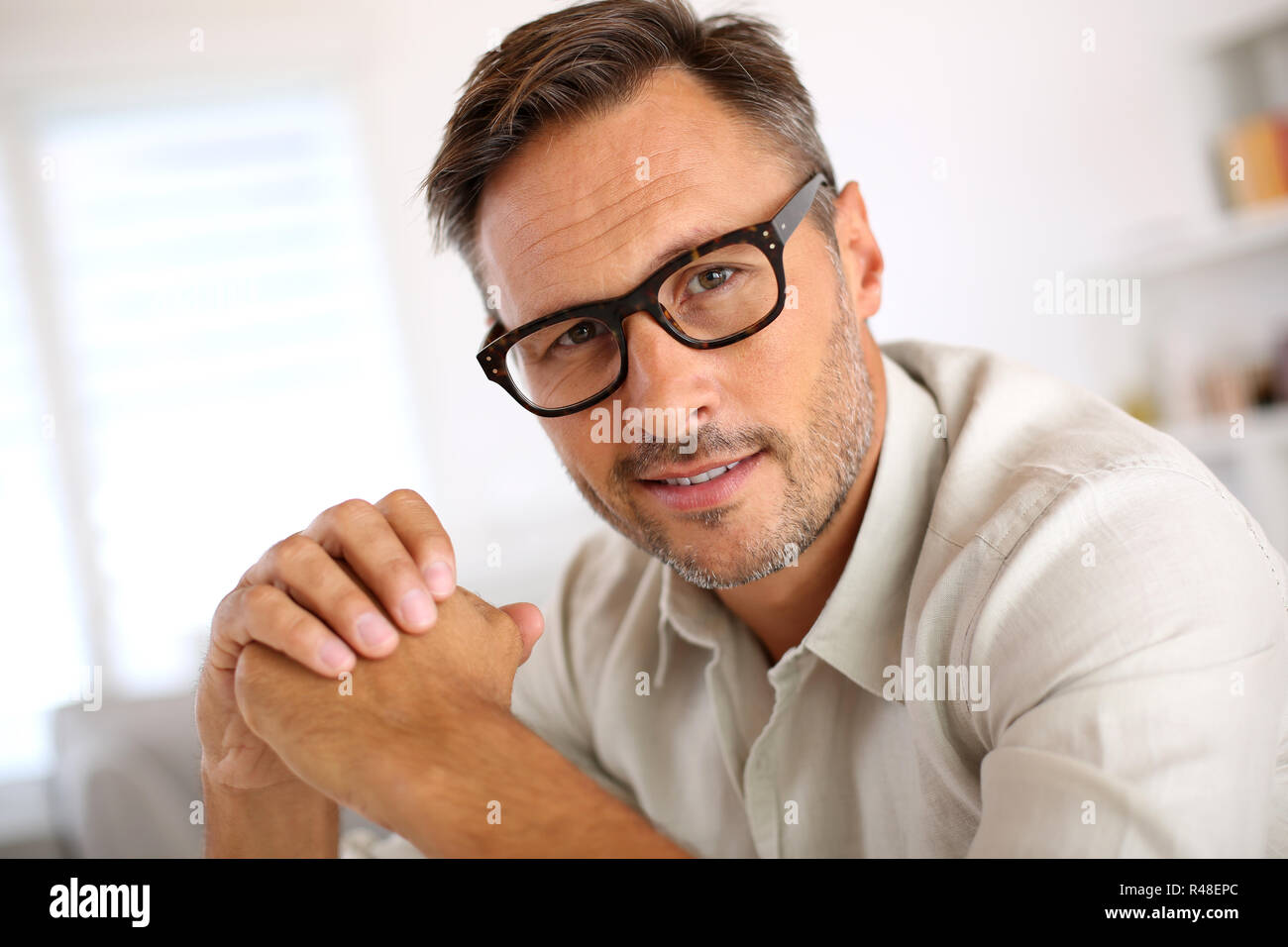 Man 40 glasses unshaved hi-res stock photography and images - Alamy