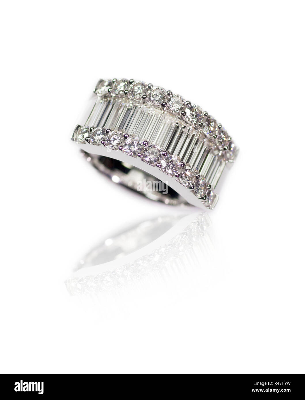 Diamond encrusted engagment wedding anniversary ring with Emerald Cut Diamonds Stock Photo