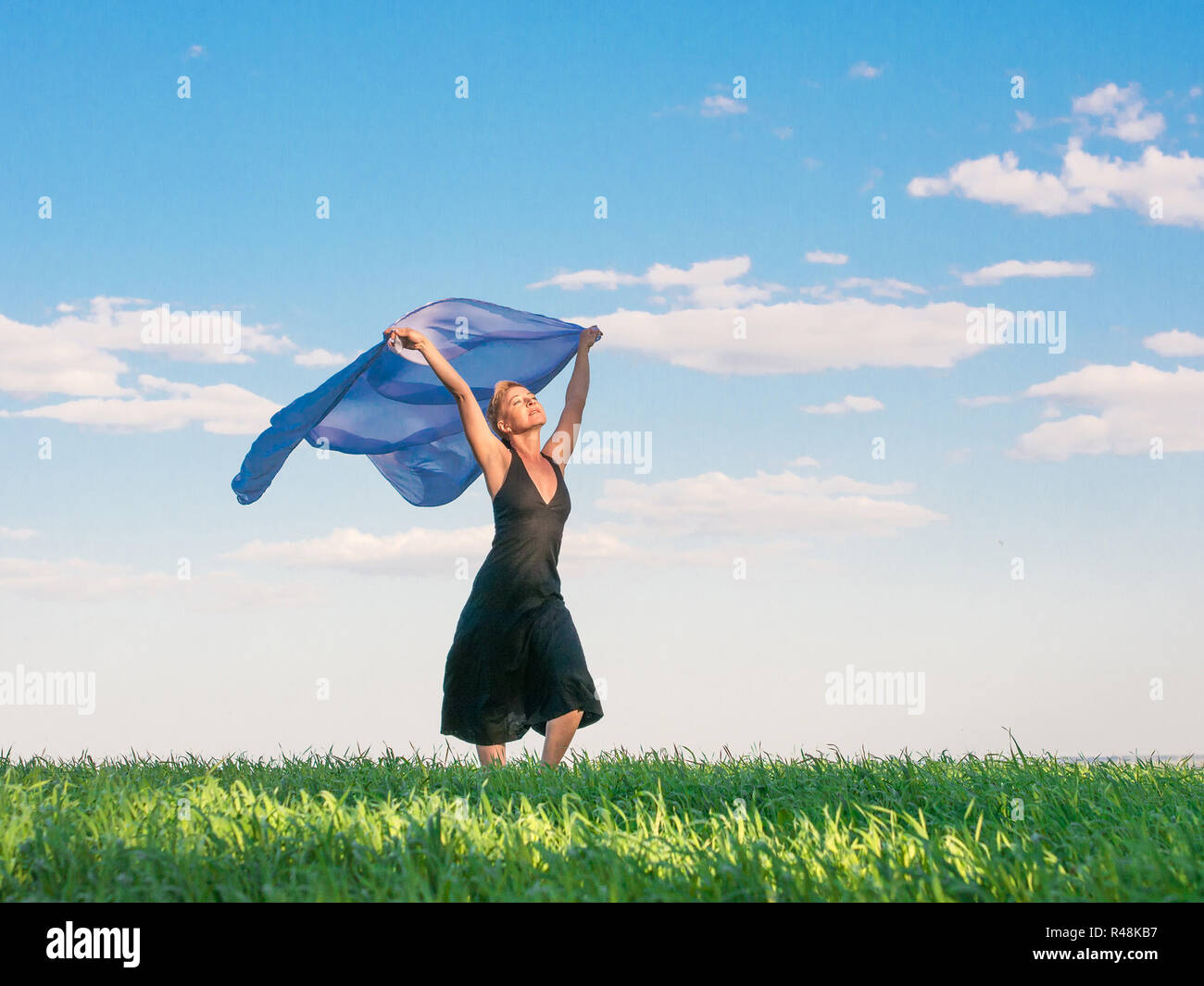 Mature woman field wind hi-res stock photography and images - Alamy