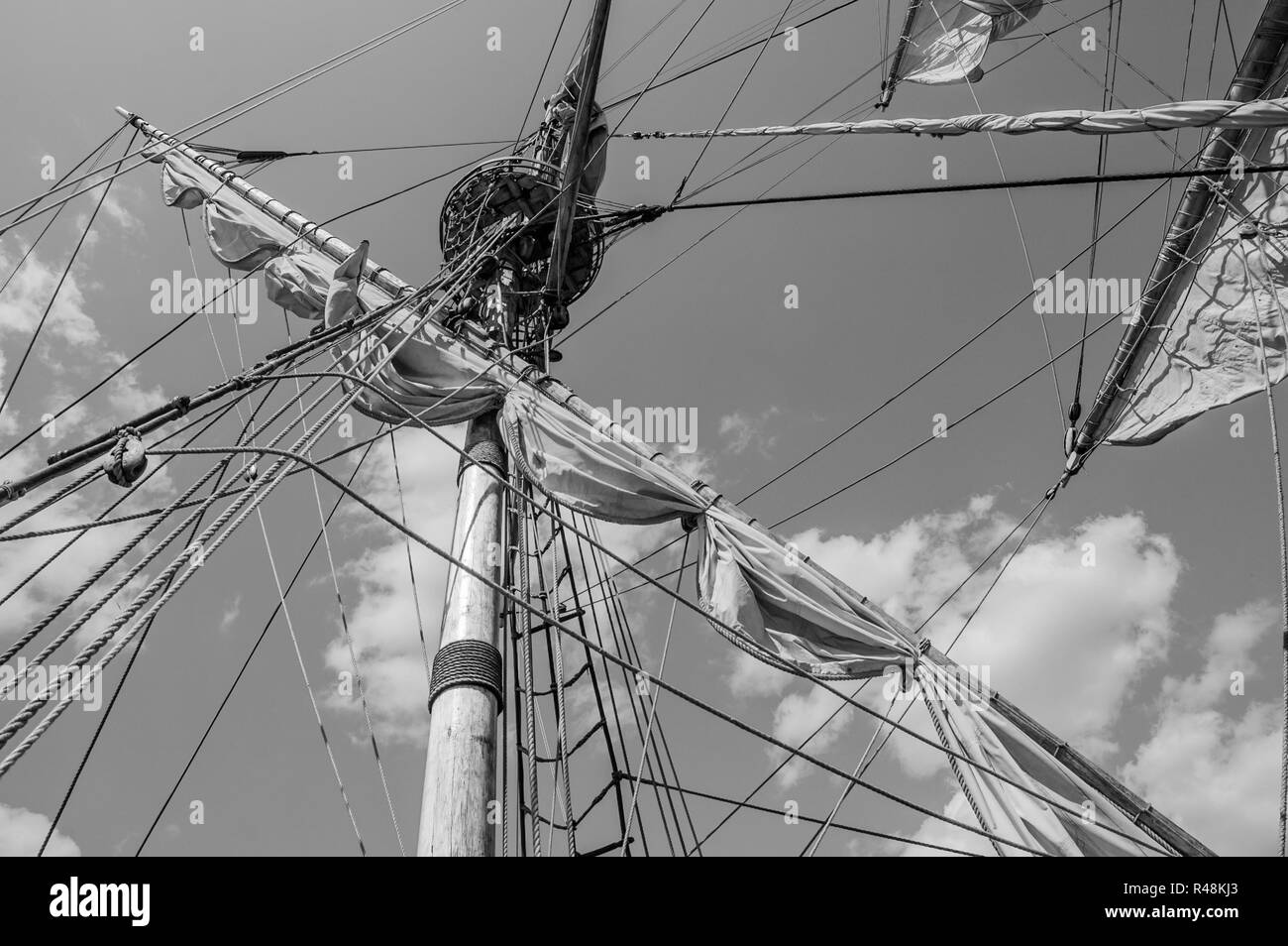 Mast with sails of an old sailing vessel, black and white photo Stock Photo