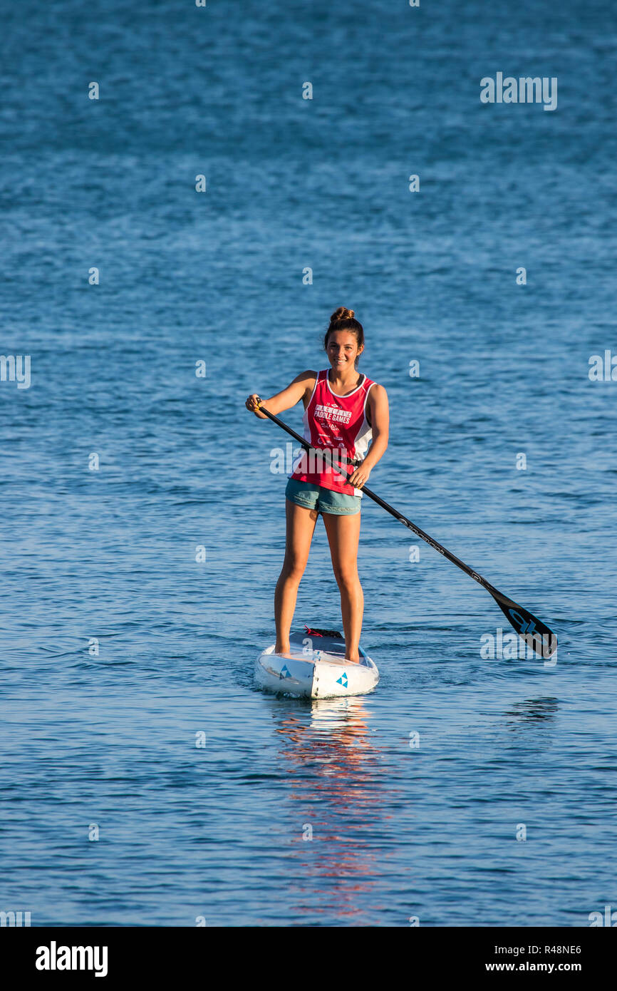 Young girl on a stand up and paddle board in California USA Stock Photo