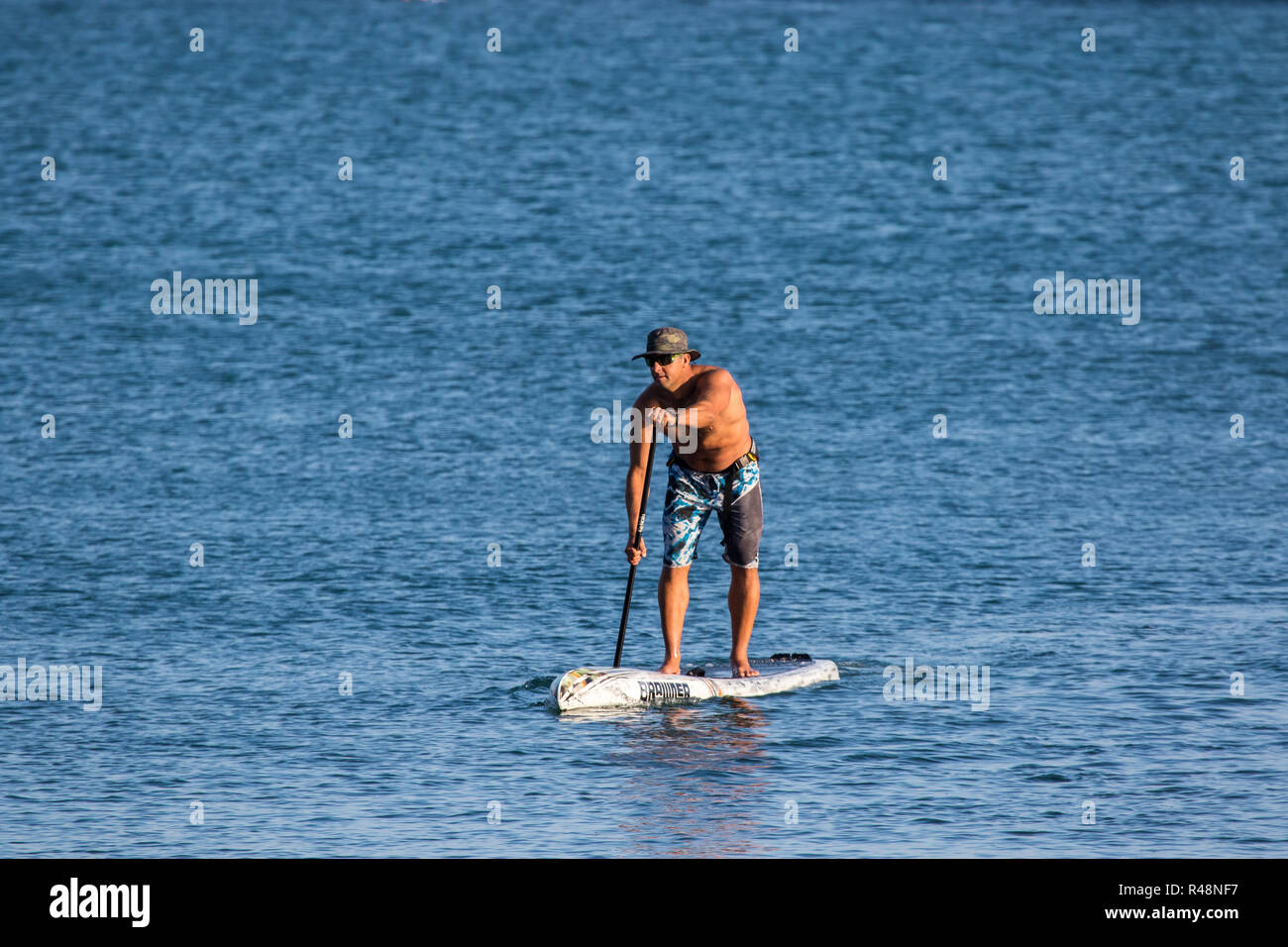 Man on a stand up and paddle board in California USA Stock Photo