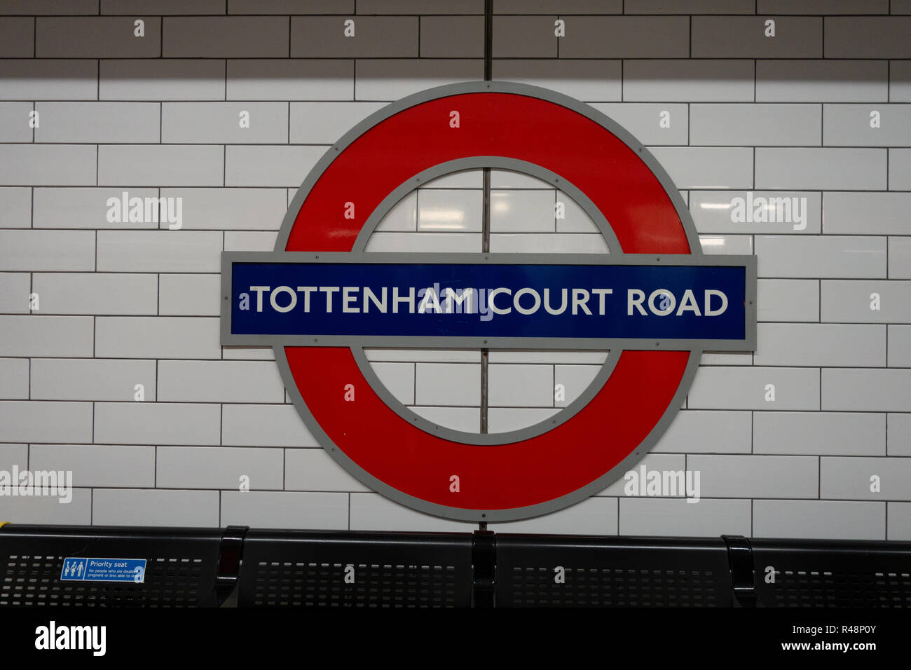 Tottenham Court Road London Iconic Underground Tube Logo sign Stock Photo