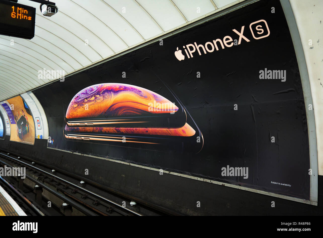 Apple iPhone XS, ad poster Advertising poster in the London Underground next the track Stock Photo Alamy