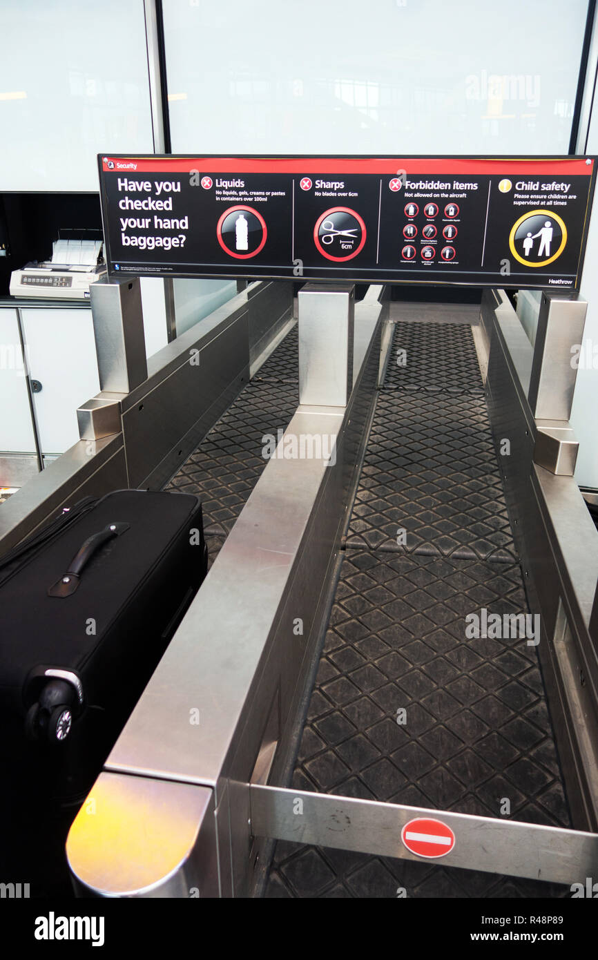 Suitcase on the Checkin conveyor belt at Heathrow Airport