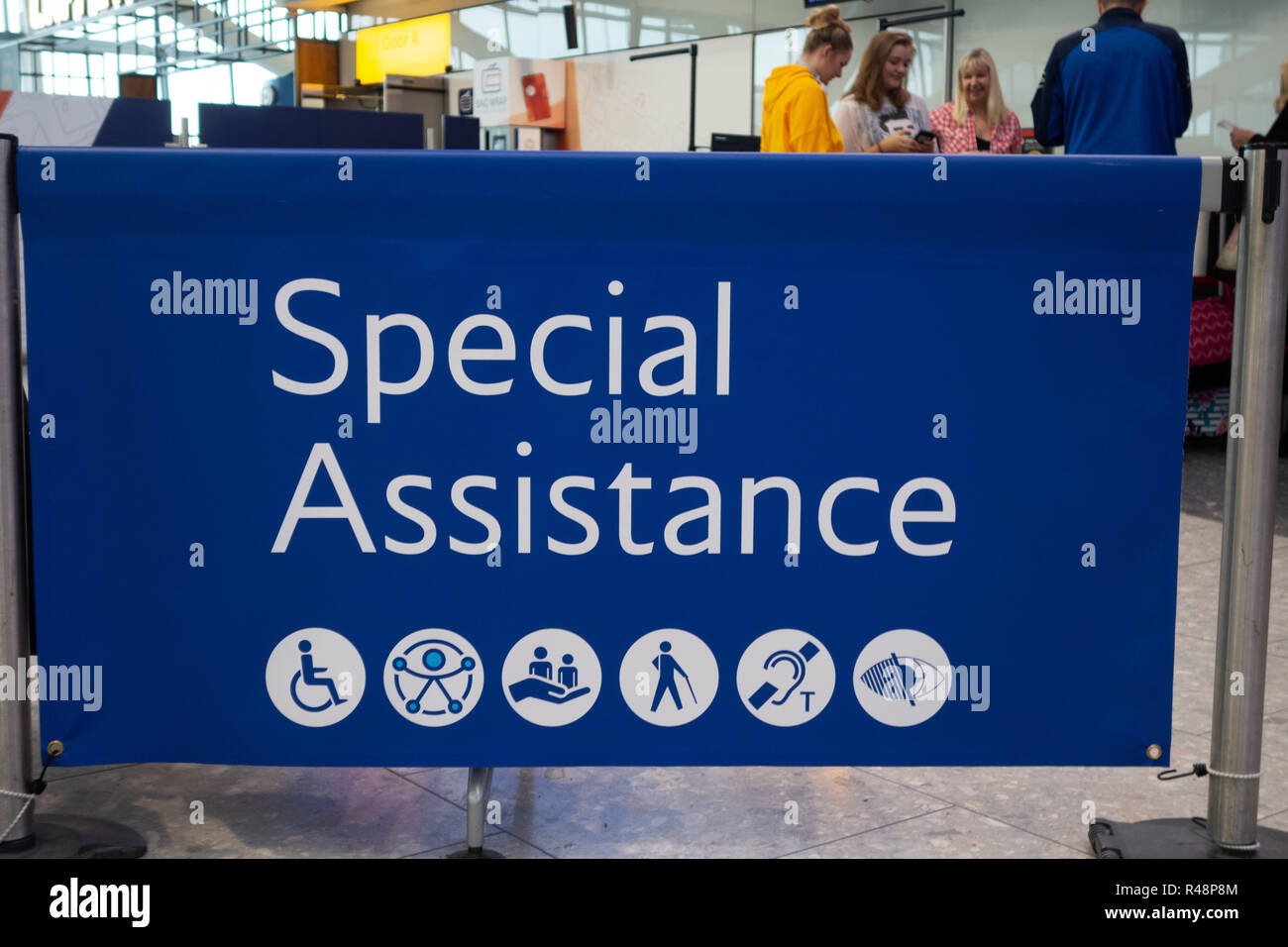 British Airways Special Assistance Sign at Heathrow Airport International Airport in London, United Kingdom. Stock Photo