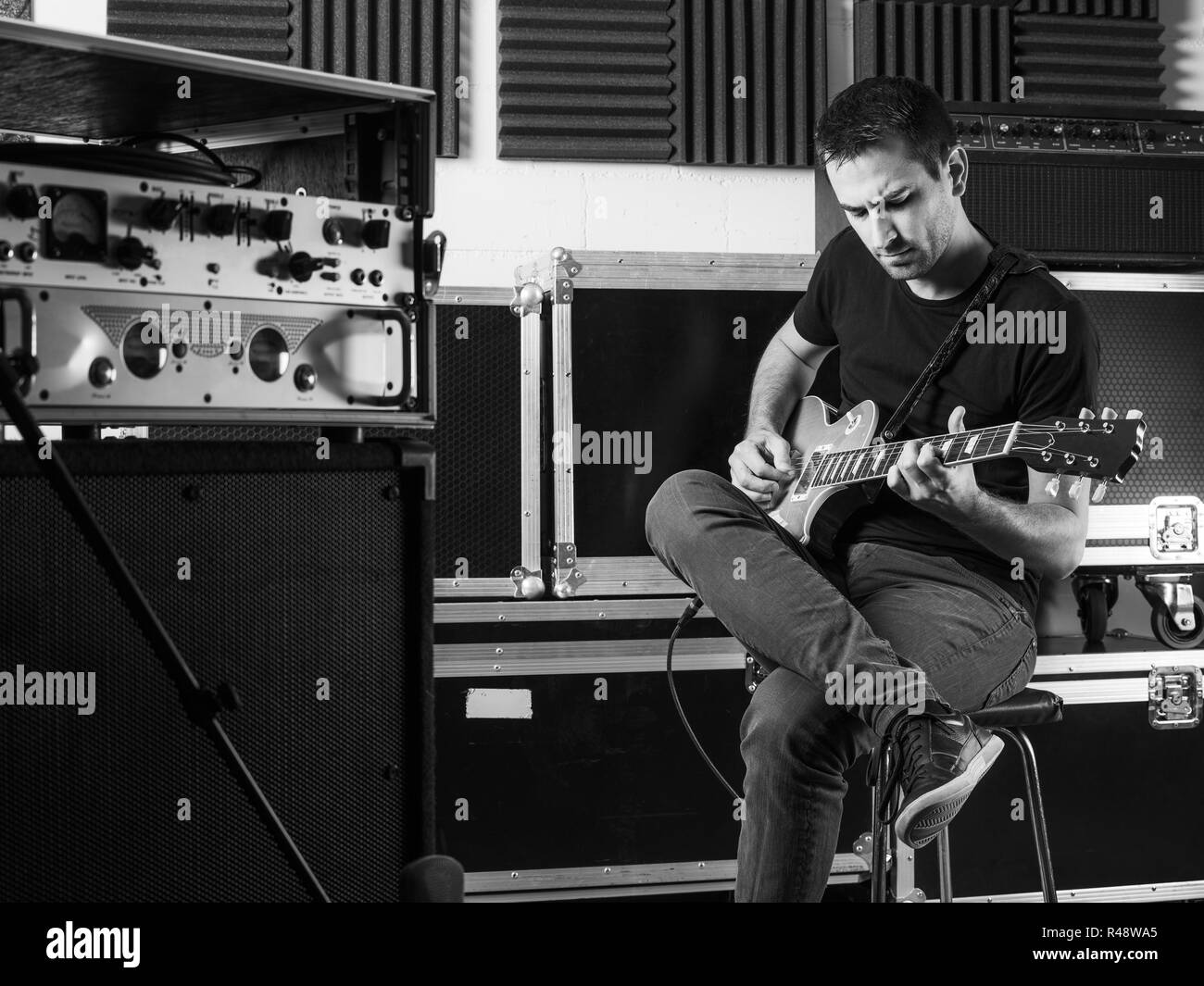 Guitarist playing backstage Stock Photo