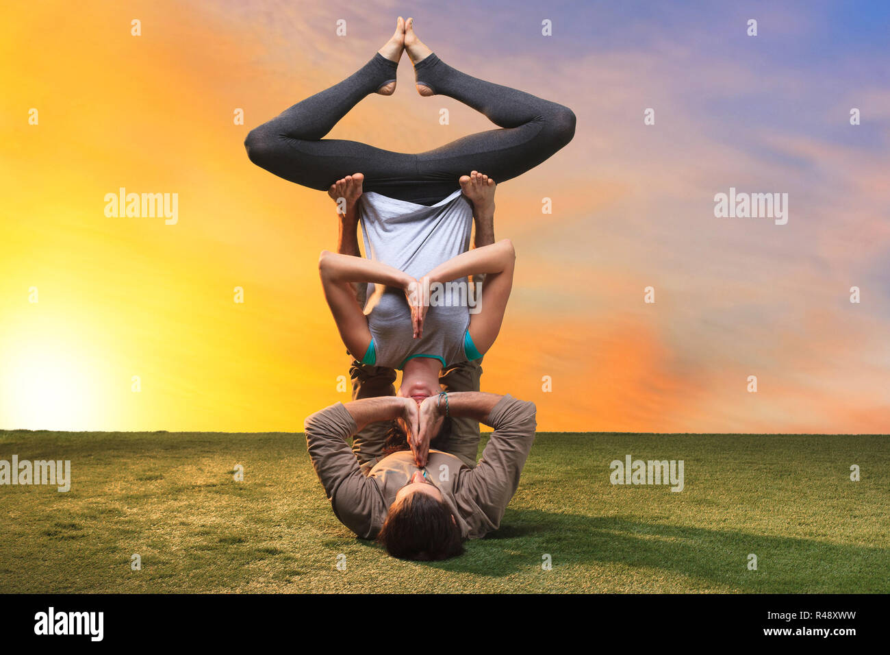 The two people doing yoga exercises Stock Photo - Alamy