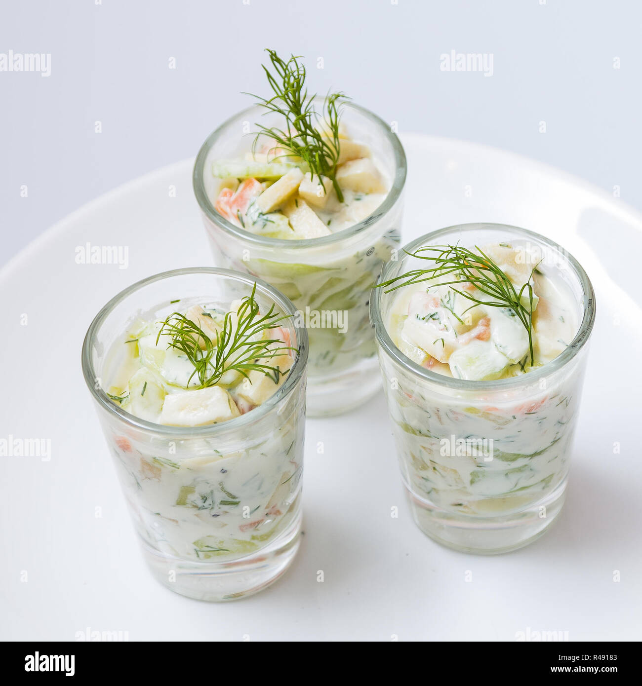 apple cucumber salad with salmon,serving Stock Photo