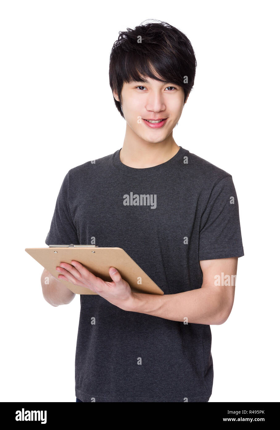 Asian Young man hold with clipboard Stock Photo - Alamy