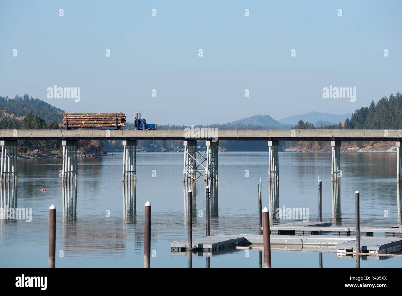Log truck crossing bridge over the Priest River in Priest River, Idaho