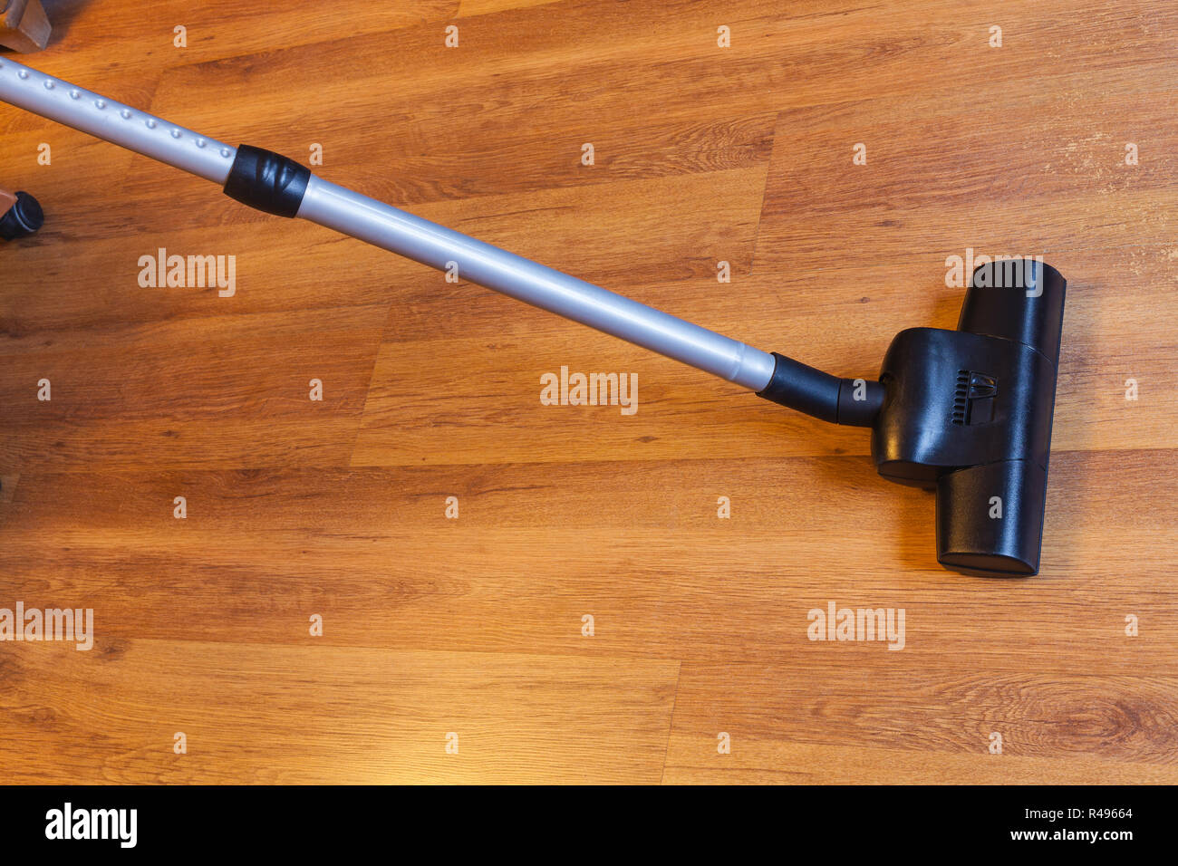 vacuuming of laminate floor by vacuum cleaner Stock Photo Alamy