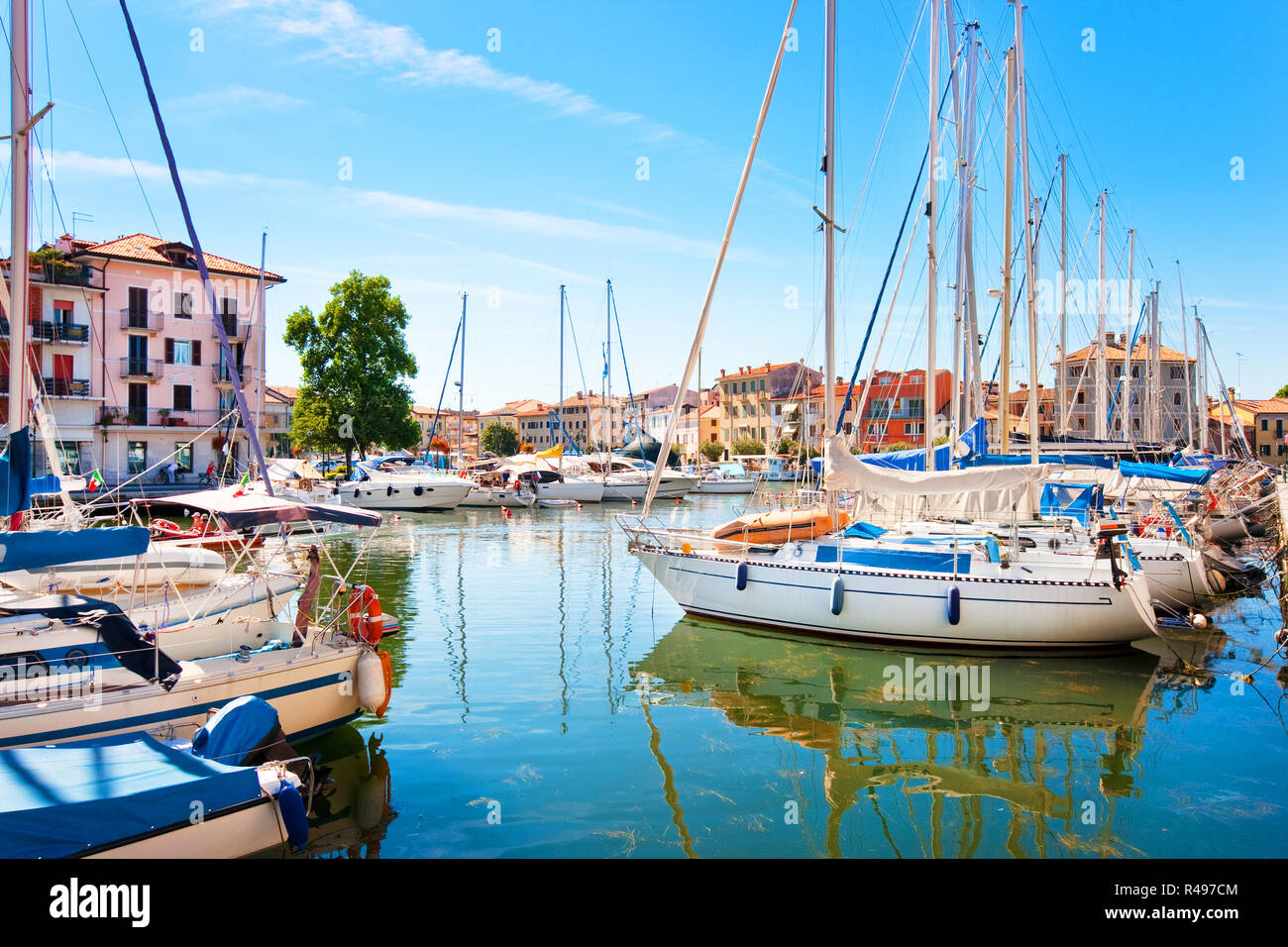 Beautiful scene of boats lying in the harbor of Grado, Friuli-Venezia Giulia, Italy at Adriatic Sea Stock Photo
