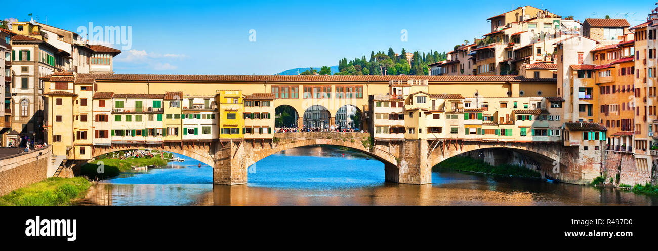 Panoramic view of famous Ponte Vecchio with river Arno at sunset in Florence, Italy Stock Photo