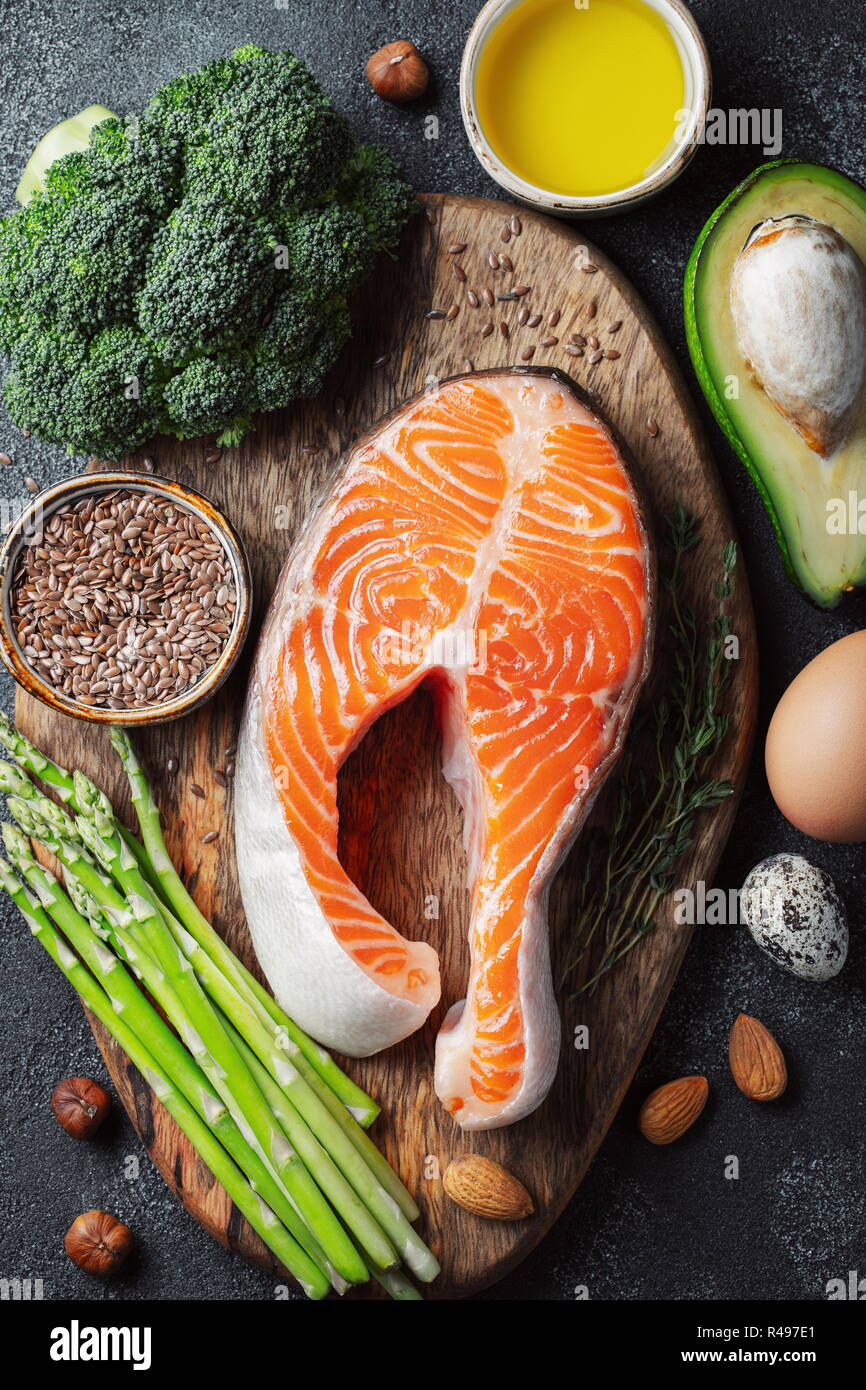 A set of healthy food for keto diet on a dark background. Fresh raw