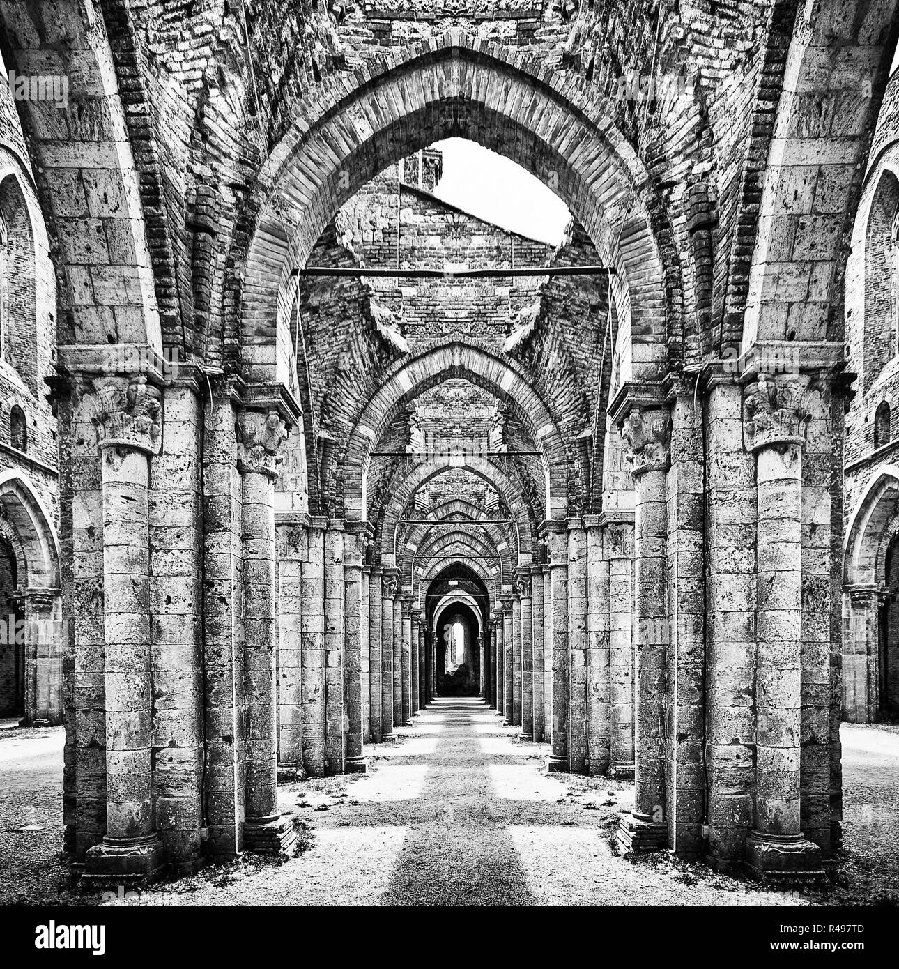 Historic ruins of abandoned abbey in black and white Stock Photo